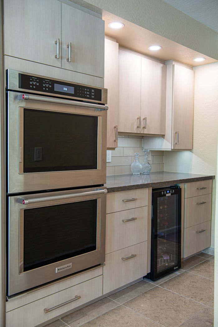 Sleek modern kitchen featuring double ovens and minimalist cabinetry design.